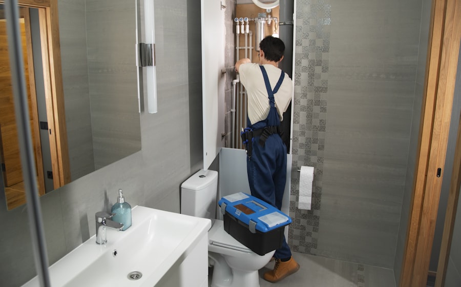 A plumber repairing pipework on a job