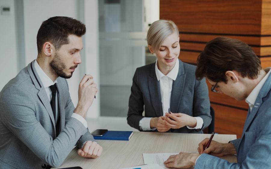 Professionals reviewing and signing a contract